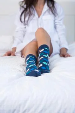 Trying on her new socks. Stock Photos