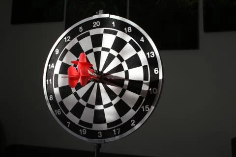 Trying to hit the dartboard Stock Photos