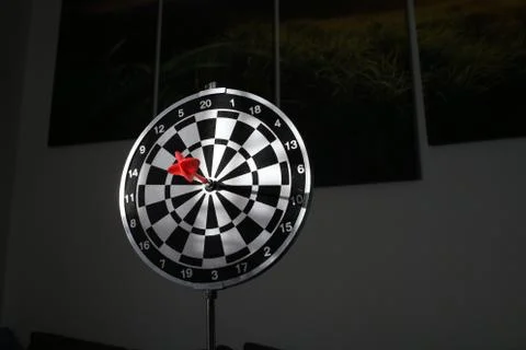 Trying to hit the dartboard Stock Photos