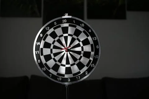 Trying to hit the dartboard Stock Photos
