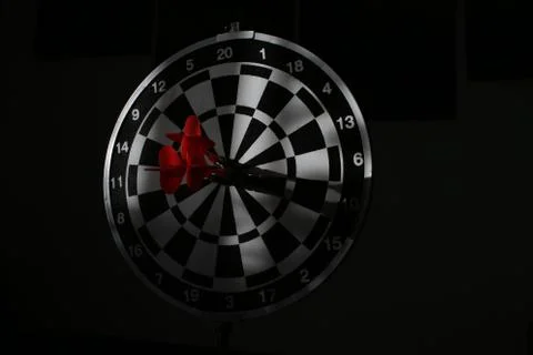 Trying to hit the dartboard Stock Photos