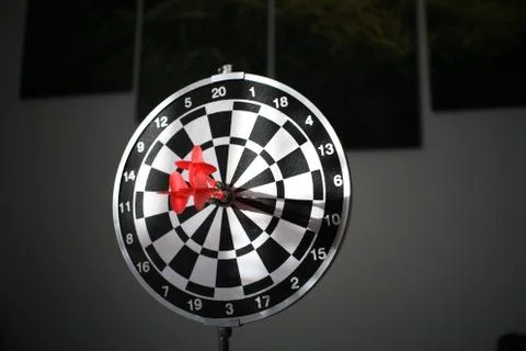 Trying to hit the dartboard Stock Photos