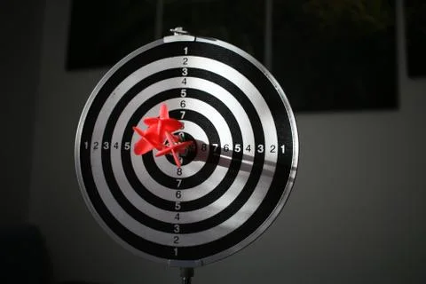 Trying to hit the dartboard Stock Photos