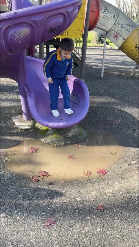 Trying to Jump Over Puddle, Talcahuano, Chile - 03 Jun 2025 Stock Footage 310630337
