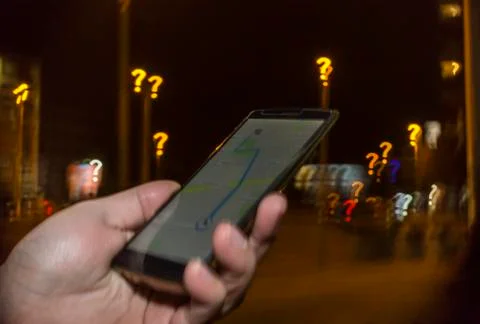 Trying to navigate in the city at night Stock Photos