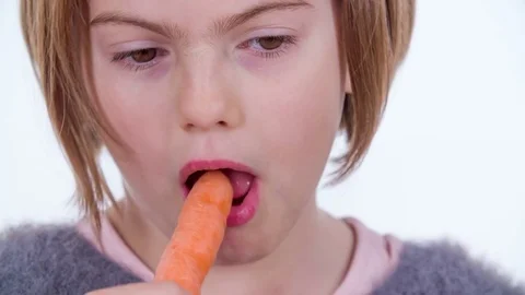 Trying out carrots Stock Footage 83725419
