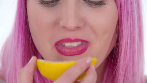 Trying out a lemon and it's very sour Stock Footage 83725188