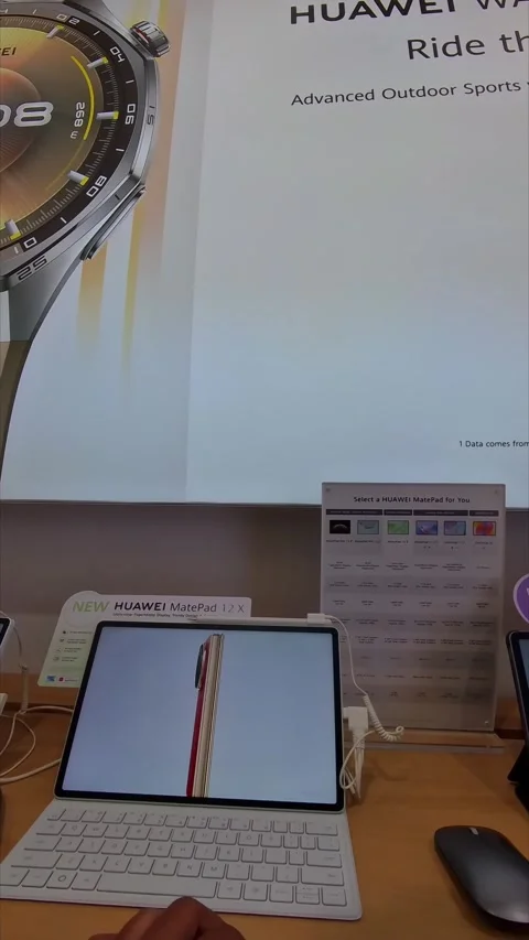 Trying out a tablet computer on display Stock Footage 333426161