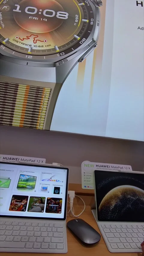 Trying out a tablet computer on display Stock Footage 333427865