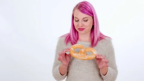 Trying a pretzel and loving it Stock Footage 83724644