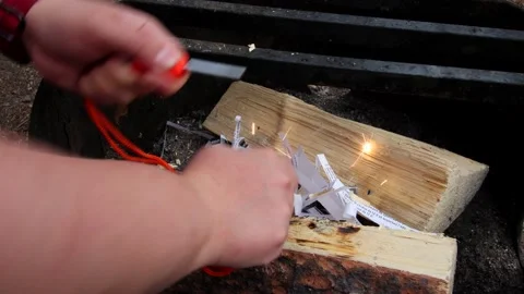 Trying to Start a Fire with a Fire Steel or Fire Starter Stock Footage 196903313