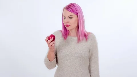 Trying a tasty red apple Stock Footage 83724566