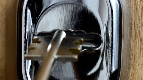 Trying to turn the broken key in the keyhole with no result close up Video stock 236932292