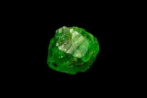Tsavorite garnet on dark background Stock Photos