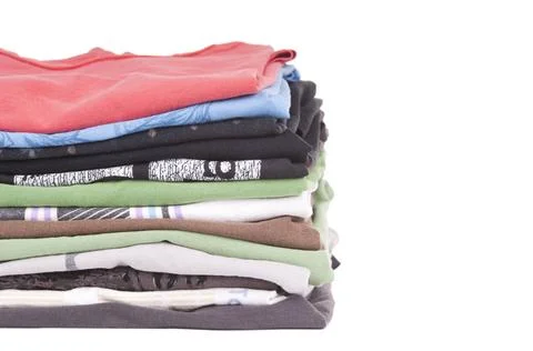 Tshirt Stack Isolated T-Shirts folded and stacked in variety of colors iso... Stock Photos