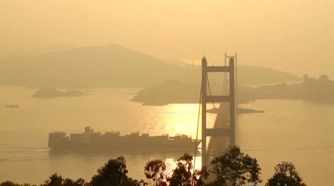 Tsing Ma Bridge and Container ship at Sunset Stock Footage 919210