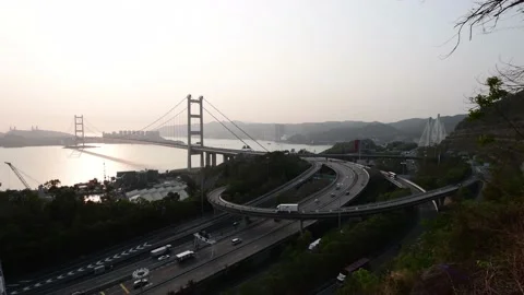 Tsing Ma Bridge from Tsing Yi under sunset Part A Stock Footage 154269115