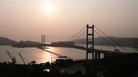 Tsing Ma Bridge from Tsing Yi under sunset Part B Stock Footage 154269325