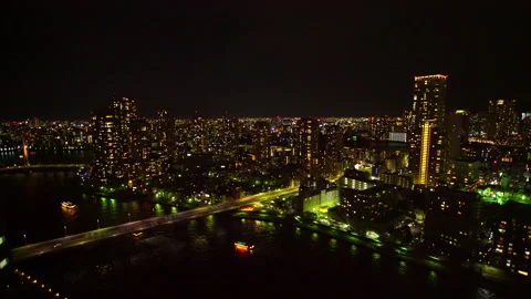 Tsukuda's Apartment Complexes, Sumida River, Tsukuda Bridge, Water Buses, and Video stock 330942299