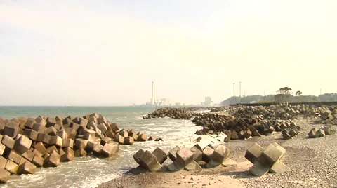 Tsunami Damage and Nuclear Power Plant in the background near Fukushima Stock Footage 41380847