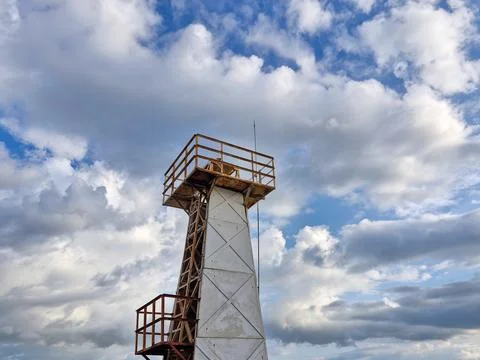 Tsunami Warning Tower with cloudy sky background Stock Photos