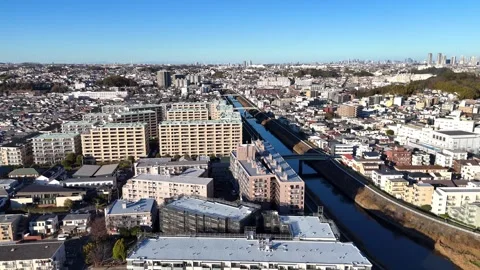Tsunashima Cityscape | River View - 4K Aerial Video Stock Footage 329056664