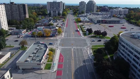 TTC buses and mobility van in bus lanes picking up passengers in urban Stock Footage 232766628