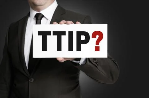 TTIP sign is held by businessman. Stock Photos