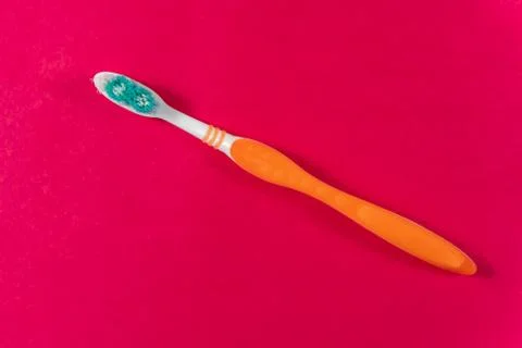 Ttoothbrush on a pink background. Stock Photos