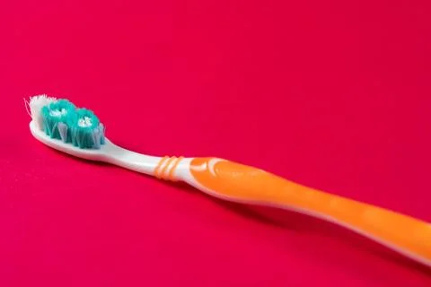 Ttoothbrush on a pink background. Stock Photos