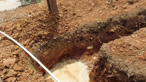 Ttrench built for water on a small construction site Stock Footage 111233594