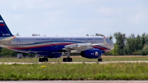 Tu-204 Russian medium-range passenger aircraft taxis on runway after landing. Stock Footage 120682269