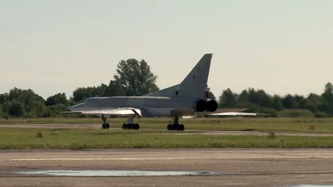 Tu-22M3 bomber makes turn from taxiway on runway  towards start Stock Footage 110869557