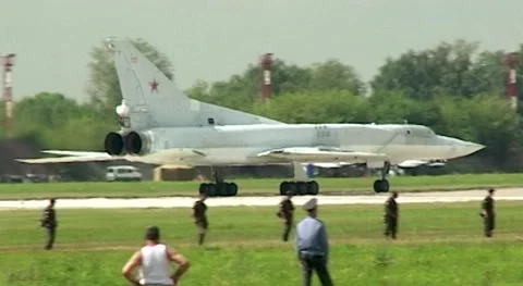 Tu-22M3 long-range missile-carrying bomber moves along runway. MAKS - 200 Stock Footage 194534392
