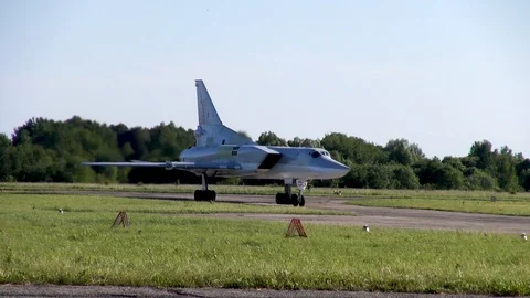 Tu-22M3 supersonic bomber with variable sweep wing steers across runway. Stock Footage 122817393