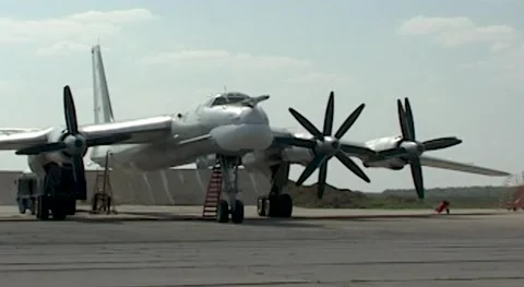 Tu-95MS (NATO: - Bear). Starting first left engine at starting position Stock Footage 171802842