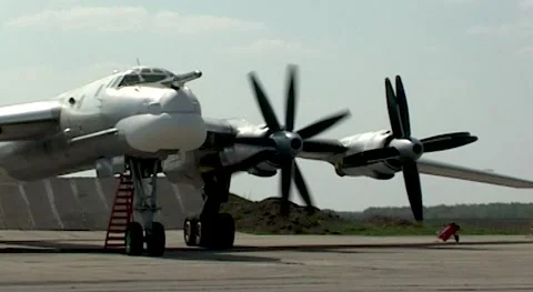 Tu-95MS (NATO: - Bear). Starting first left engine at starting position Stock Footage 171814292