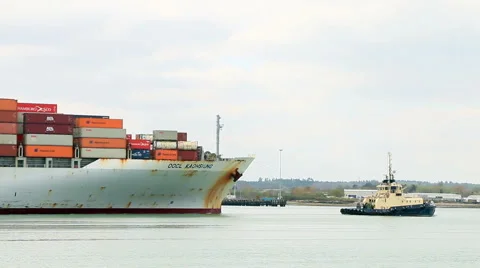 Tub boat pulling a container ship real time 2 Stock Footage 46074591