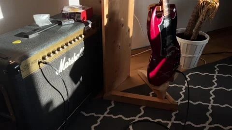 Tube guitar amplifier with knobs and electric guitar 스톡 동영상 278592704