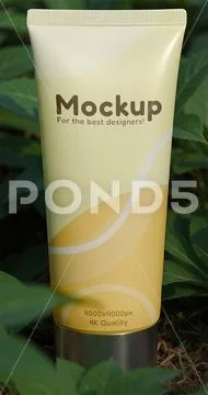 Tube packaging mockup in the middle of a plantation PSD Template