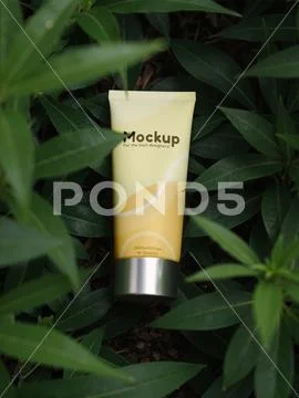 Tube packaging mockup in a plant setting PSD Template