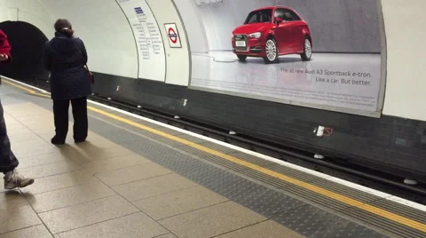 Tube platform, train stops and then departs Stock Footage 48032726