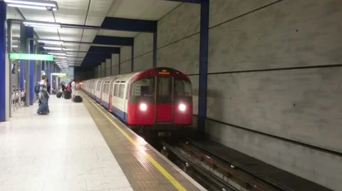 The tube train is arriving to the platform at the Heathrow Terminal 5 station Stock Footage 67360994