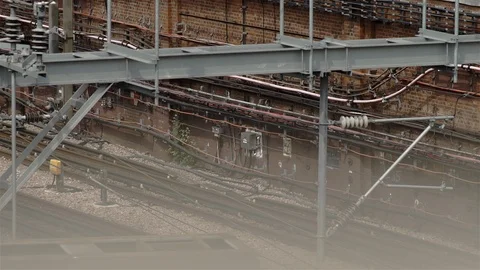 Tube train passing under overhead gantry. London, UK Stock Footage 93209937