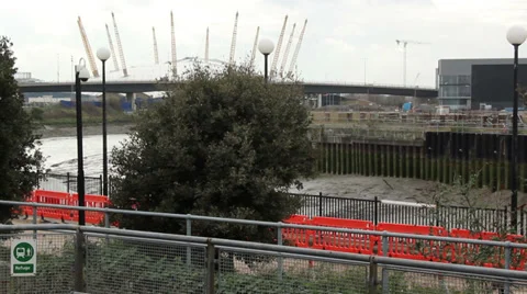 Tube train pulling out of station millennium dome Stock Footage 36363597
