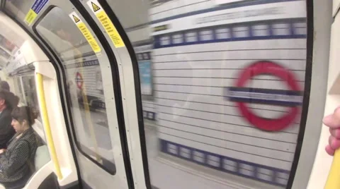 A Tube Train pulls into Leicester Square station in Central London Video stock 41455725