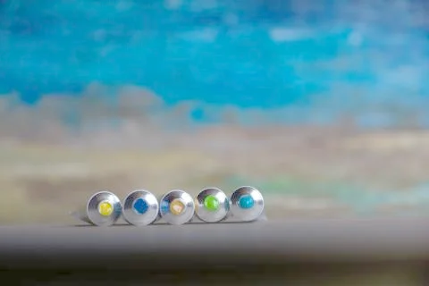 Tubes close-up with bright multi-colored watercolors blue, yellow, green shad Stock Photos