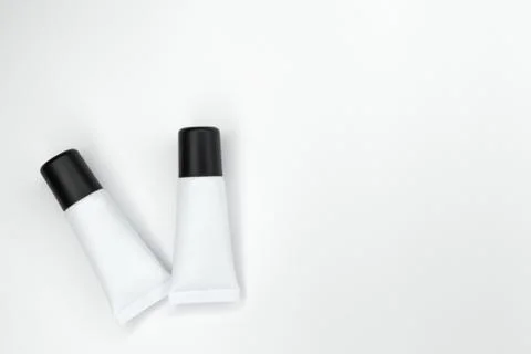 Tubes with cosmetics on a white background. Stock Photos