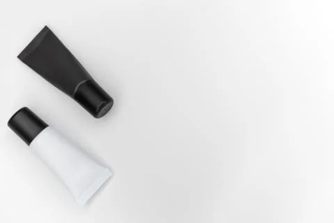 Tubes with cosmetics on a white background. Stock Photos