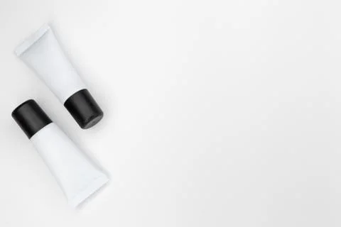 Tubes with cosmetics on a white background. Stock Photos
